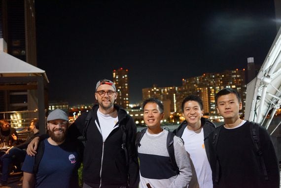 The Set Labs team, with CEO Felix Feng at center, pose for a photo in Osaka, Japan.