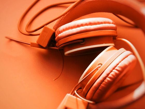CDCROP: Close-Up Of Headphones On Table (Getty Images)