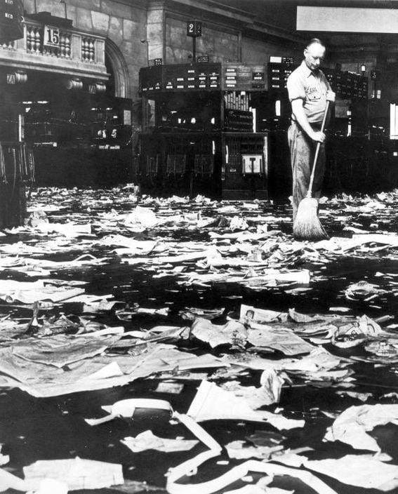Cleaner sweeping the floor after the Wall Street stock market crash of 1929. Source: Wikimedia Commons
