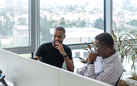 CEO Yele Bademosi and Taiwo Orilogbon, head of engineering, discuss business at the Bundle offices.