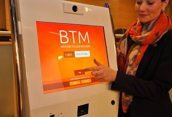  Victoria van Eyk demonstrates use of a bitcoin ATM to the Senate