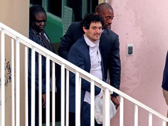 CDCROP: FTX co-founder Sam Bankman-Fried is escorted out of the Magistrate's Court on December 21, 2022 in Nassau, Bahamas. (Joe Raedle/Getty Images)
