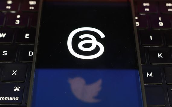 Twitter and Threads logos are displayed on a cell phone (Justin Sullivan/Getty Images)