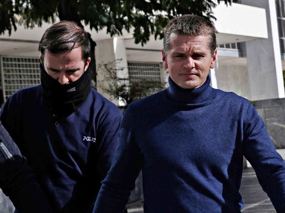 The Russian bitcoin fraud suspect Alexander Vinnik (right) escorted to the Supreme Court in Greece on Nov. 15, 2017. (Alexandros Michailidis/Shutterstock)