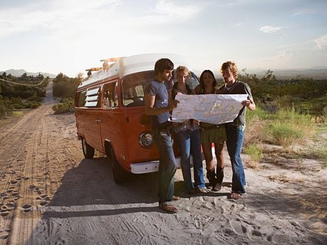 CDCROP: Friends on a road trip looking at a map lost (Image Source/Getty Images)