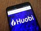 CDCROP: Huobi App on Smartphone (Piotr Swat/Shutterstock)