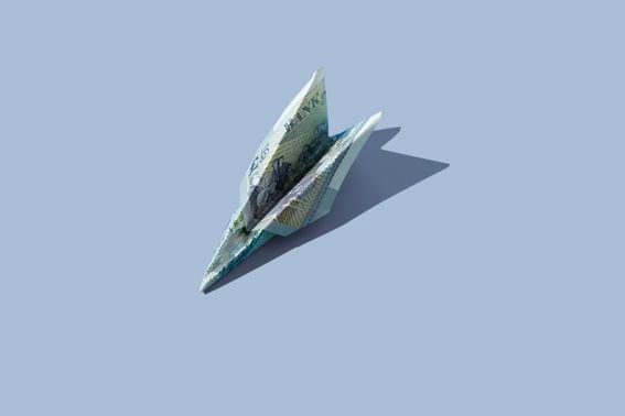 5 pound banknote in shape of airplane (Yulia Reznikov/Getty Images)
