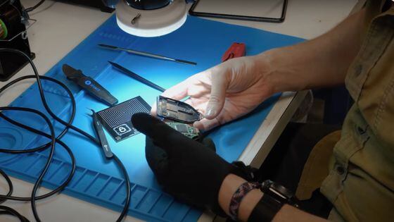 Unciphered lab technician decasing the Trezor T. (Unciphered)