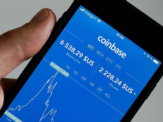 PARIS, FRANCE - OCTOBER 05:  In this photo illustration, the Coinbase cryptocurrency exchange application is seen on the screen of an iPhone on October 05, 2018 in Paris, France. The California cryptocurrency platform is about to raise $ 500 million in the event of an IPO. After having exceeded 20 million users this summer, the cryptocurrency trading platform has seen its financial value further increase. The California start-up is now valued at $ 8 billion.  (Photo Illustration by Chesnot/Getty Images)