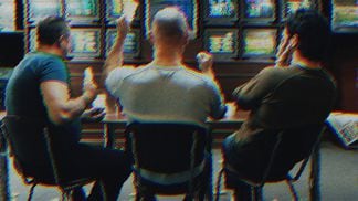 Three men in a betting shop (Image Source/Getty Images, Modified by CoinDesk)