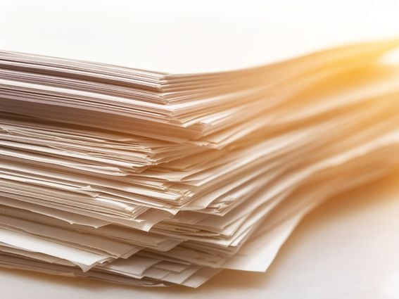 CDCROP: Pile of paper documents on background, close up (artisteer/Getty Images)