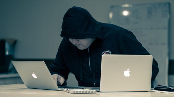 A hacker (Azamat E/Unsplash)