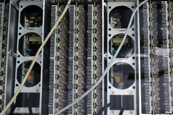 Bitcoin mining machines submerged in immersion cooling liquid at a facility in South Spain. (Eliza Gkritsi)