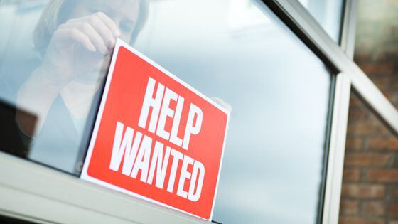 HELP WANTED Recruitment Sign Displayed for Hiring, Employment (YinYang/Getty)