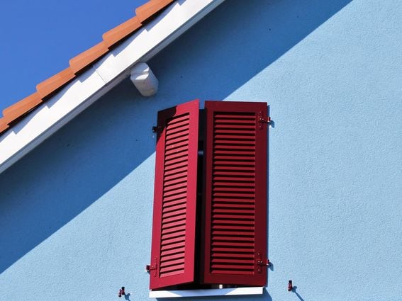 A window with red shutters, representing a shuttered Beacon Chain for Ethereum.