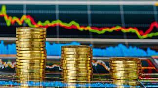CDCROP Investment charts coins stacked (Shutterstock)