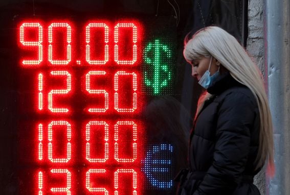 A sign displays forex rates to the ruble at an exchange bureau in Moscow on Monday. (Getty Images)