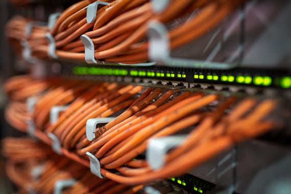 Network cables connected to bitcoin mining rigs (Andrey Rudakov/Bloomberg via Getty Images)