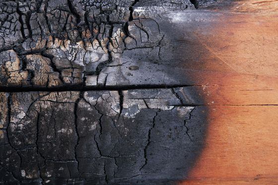 Burnt wood texture as a background representing fee burning on Ethereum post EIP 1559