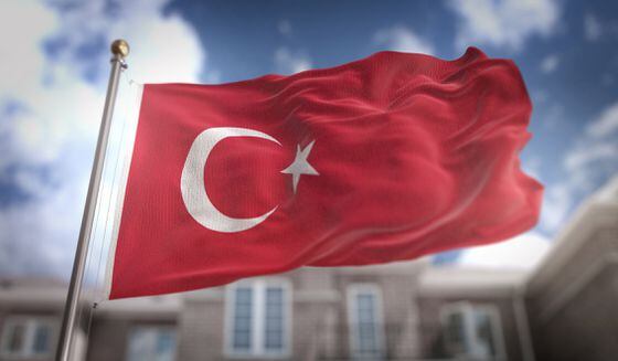 Turkey Flag 3D Rendering on Blue Sky Building Background