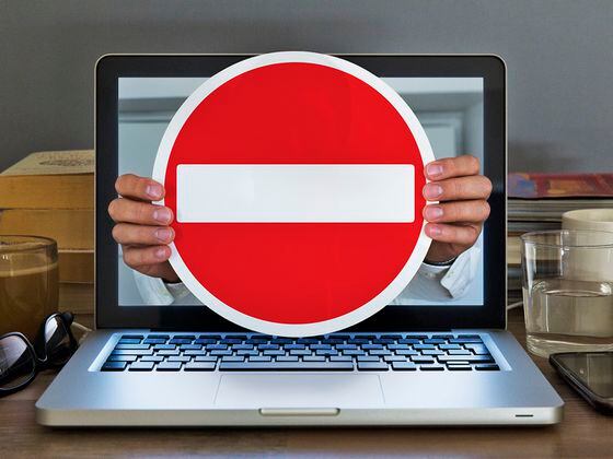 CDCROP: No entry sign appearing out of laptop computer (Getty Images)