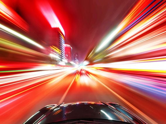 CDCROP: A car driving on a motorway at high speeds, overtaking other cars (Shutterstock)