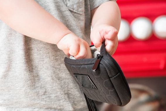 Child taking money from a wallet