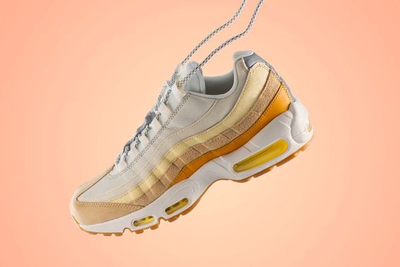 Woman sneaker on a light peach gradient background (David Peperkamp/Getty Images)