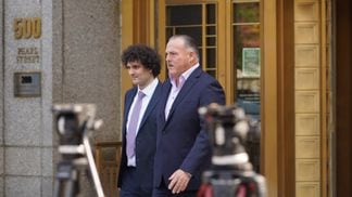 Sam Bankman-Fried (left) exits a courthouse after a hearing on July 26, 2023. (Nikhilesh De/CoinDesk)