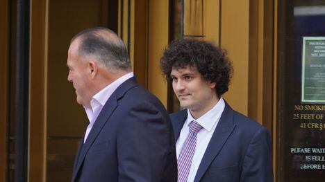 Despite claims by right-wing political figures, Sam Bankman-Fried was definitely not a free man when he (right) exited a Manhattan courtroom on July 26, 2023. (Nikhilesh De/CoinDesk)
