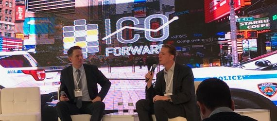 Nick Morgan, attorney at Paul Hastings, and R. Scott Forston, of S&P Global’s compliance team, converse on stage at ICO Forward Photo by Brady Dale.