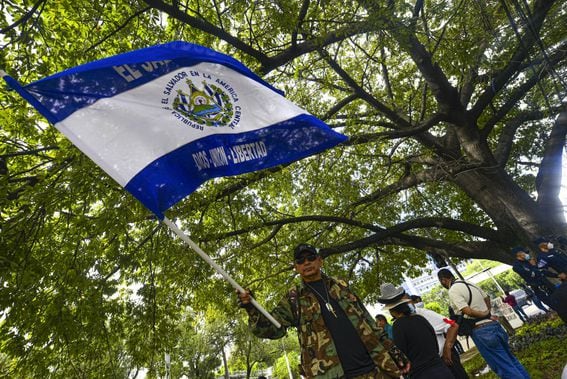 SAN SALVADOR, EL SALVADOR - AUGUST 27: A veteran waves a flag of El Salvador during a protest against the bitcoin law by veterans of the Salvadoran civil war on August 27, 2021 in San Salvador, El Salvador. The new bitcoin law should come into force on September 7. (Photo by Roque Alvarenga/APHOTOGRAFIA/Getty Images)