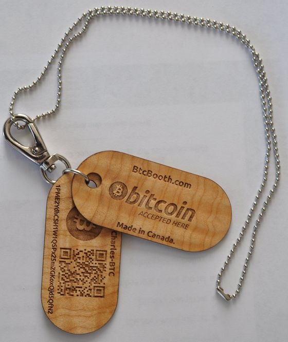  Lazaro's wooden wallet tags, which users can wear around their neck.