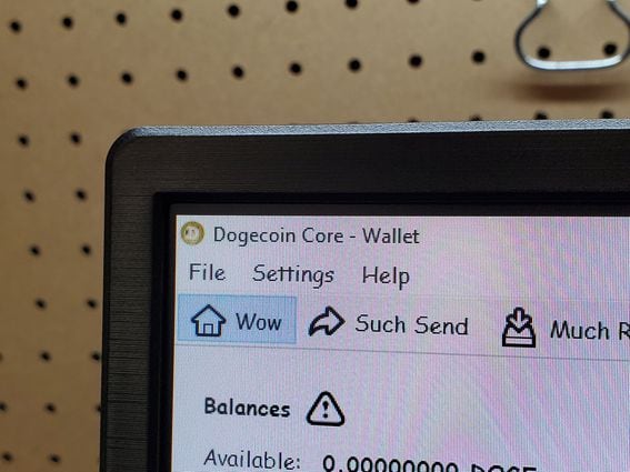 Close-up of computer running the blockchain software for cryptocurrency Dogecoin, labeled Dogecoin Core.