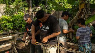 Construction workers, who are paid in Bitcoin, work on a building outside the Bitcoin Beach office in El Zonte, El Salvador, on Monday, June 14, 2021. El Salvador has become the first country to formally adopt Bitcoin as legal tender after President Nayib Bukele said congress approved his landmark proposal.