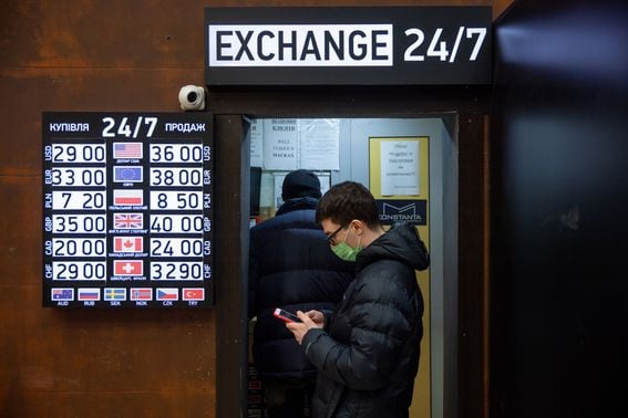 A money exchanger in Ukraine (Ethan Swope/Bloomberg via Getty Images)