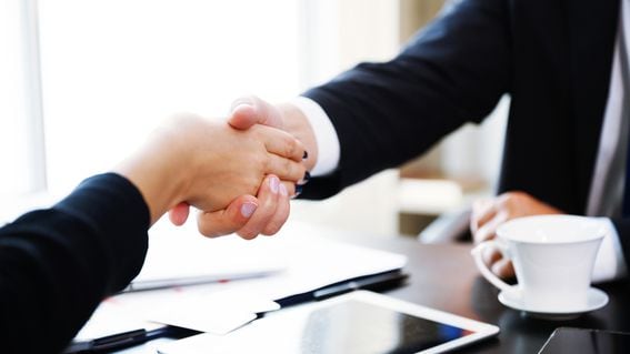 Business and office concept - businessman shaking hands each other. Human resources management and recruitment