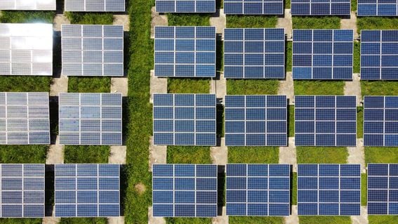 Blocks of square solar panels, illustrating how Bitcoin miners can contribute to green energy sustainability. (Anders j/Unsplash)