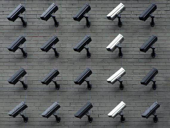 Photo of a grid of surveillance cameras.