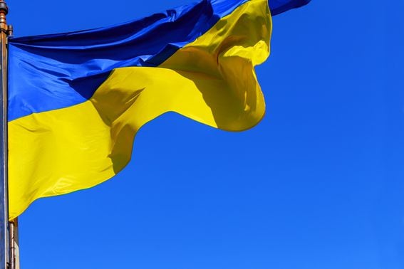 The national yellow and blue flag of Ukraine over the sky and clouds. (Valentyn Semenov/Getty)