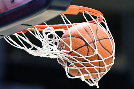 Detail view as a basketball goes through the hoop during a college basketball game