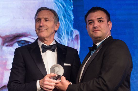Retired U.S. Army Master Sgt. Leroy A. Petry, Medal of Honor Recipient, presents Mr. Howard Schultz, Executive Chairman of Starbucks Corporation, with the Distinguished Business Leadership Award, during the Atlantic Council’s Distinguished Leadership Awards dinner in Washington, D.C., May 10, 2018. The awards also recognized former U.S. President George W. Bush, U.S. Army Gen. U.S. Army Gen. Curtis M. Scaparrotti, Commander of U.S. European Command and Supreme Allied Commander, Europe; and Ms. Gloria Estefan, Grammy Award-Winning Singer; for embodying the pillars of the transatlantic relationship for their achievement in the fields of politics, military, business, humanitarian, and artistic leadership. (DoD Photo by U.S. Army Sgt. James K. McCann)