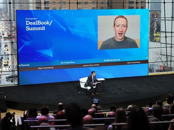 Andrew Ross Sorkin speaks with Mark Zuckerberg during the New York Times DealBook Summit. (Michael M. Santiago/Getty Images)