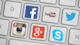 Social media icons juxtaposed on a keyboard. (Anna/Pixabay)