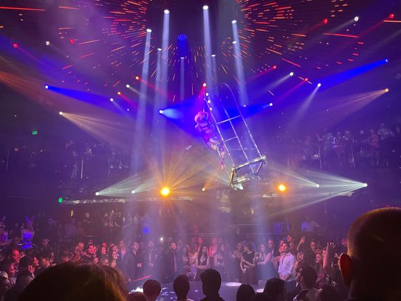 A performer dances from the ceiling at Miami's E11EVEN nightclub. (Eli Tan/CoinDesk)