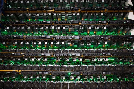 DO NOT USE: Cryptocurrency mining rigs sit on racks at a facility