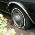 CDCROP: Flat tire on a car deflated stuck (Sebastian Huxley/Unsplash)