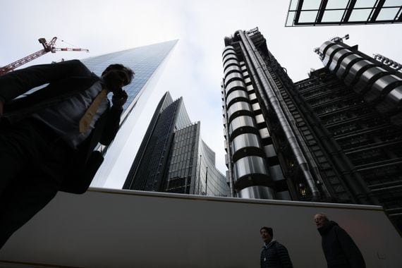 The Lloyd's of London Ltd. building, right, in the City of London, U.K., on Tuesday, Jan. 18, 2022. Lloyds of London is reviewing its real estate needs as the historic insurance market embraces flexible working. Photographer: Hollie Adams/Bloomberg via Getty Images