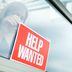HELP WANTED Recruitment Sign Displayed for Hiring, Employment (YinYang/Getty)