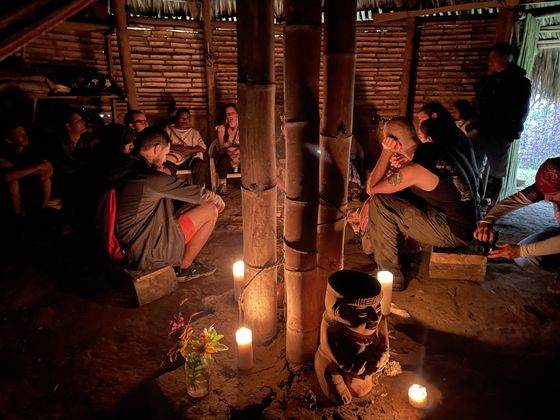 Attendees of the Blockchain Infrastructure Carbon Offsetting Working Group inaugural retreat visiting the home of a Wiwa indigenous tribe member, Sept. 2022.  (Eliza Gkritsi/CoinDesk)